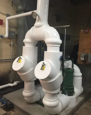 Orbacon Services insulation technician performing pipe insulation work in Bolton Ontario